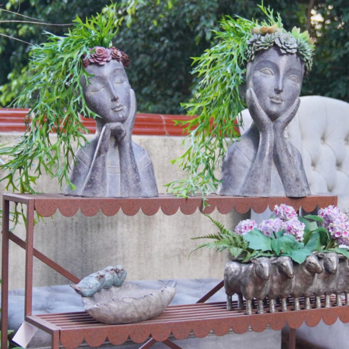 Newman House Studio Artistic garden decor planter elevates outdoor spaces.