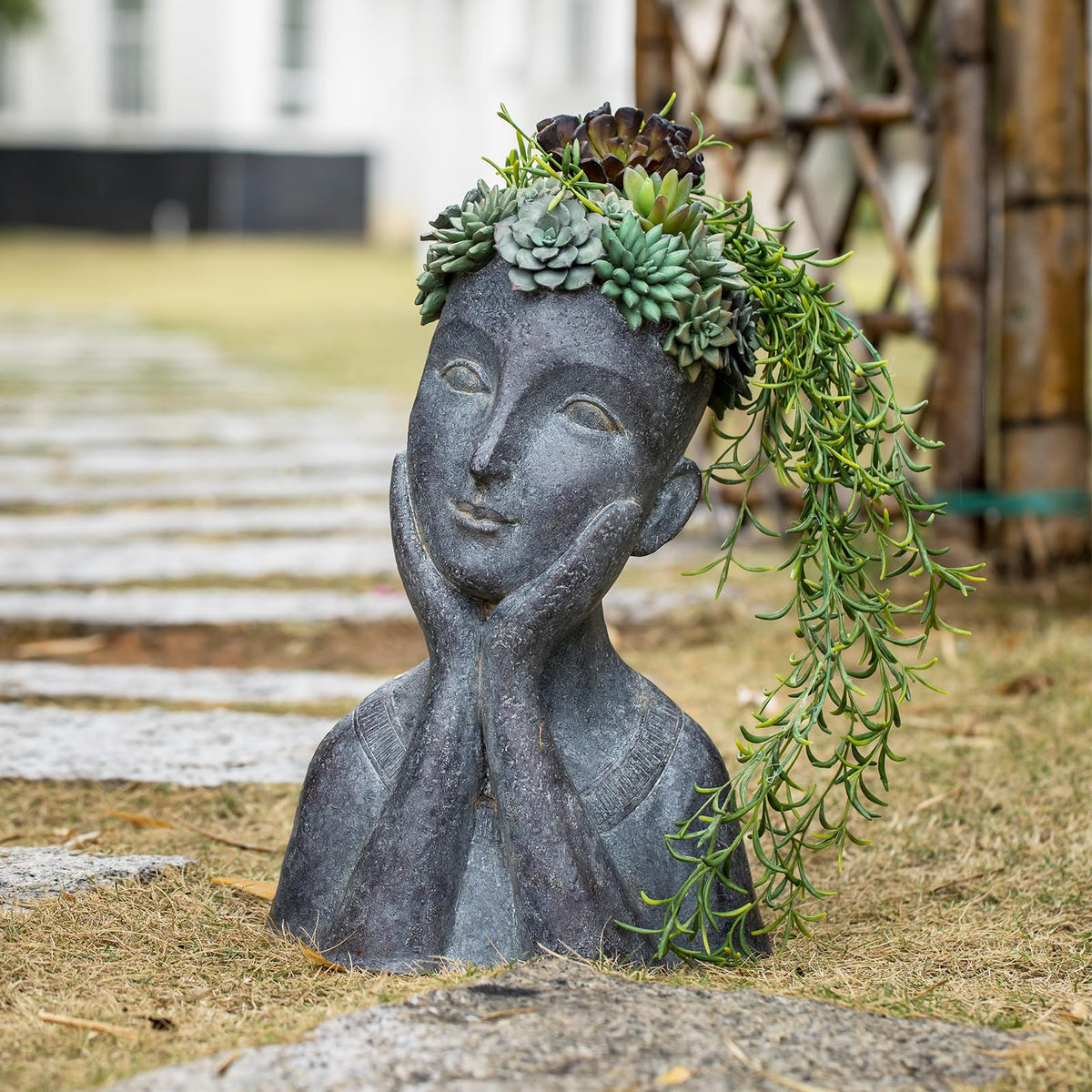 Newman House Studio Polystone planter uses durable material for long-lasting display.