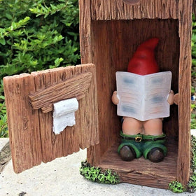 nezababy reading-newspaper-gnome adds playful charm to outdoor spaces