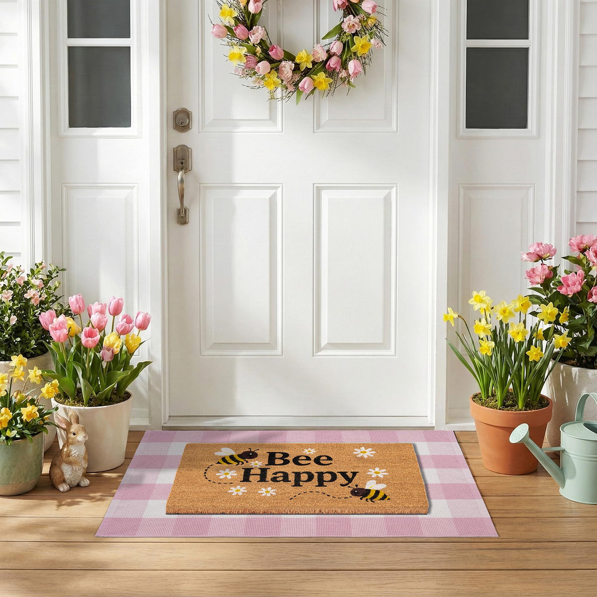 NIIKOOS Bee Happy layering rug adds depth under the doormat without blocking the door