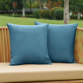 NiNi ALL dark blue outdoor pillow cover on a patio chair with textured linen finish