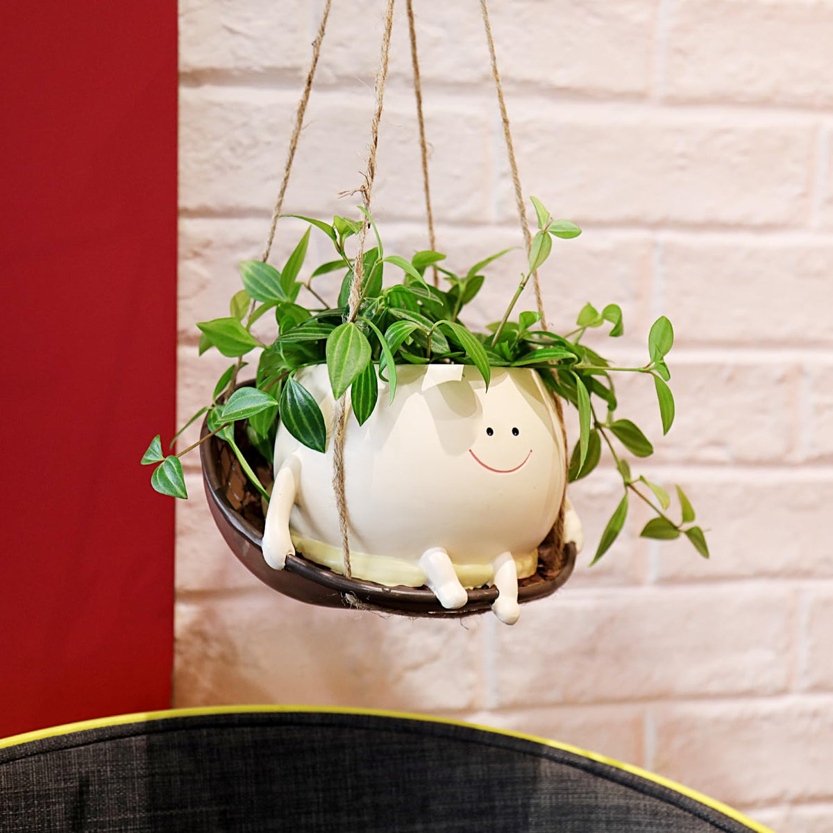 NINIPAPA smile head planter adding playful charm to spaces.