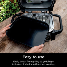 Fajitas sizzling on Ninja Woodfire flat top griddle plate with direct heat