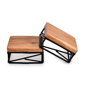 Close-up of the warm wooden texture on the Riser Square highlighting craftsmanship.