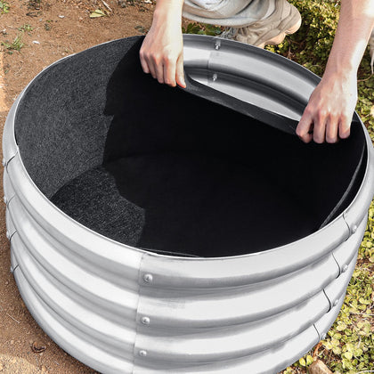 Niuyhe round fabric liner inside raised bed for vegetables and herbs.