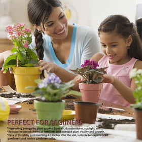 NizHome 12-inch copper coil antenna stake installed beside herbs for healthier foliage.
