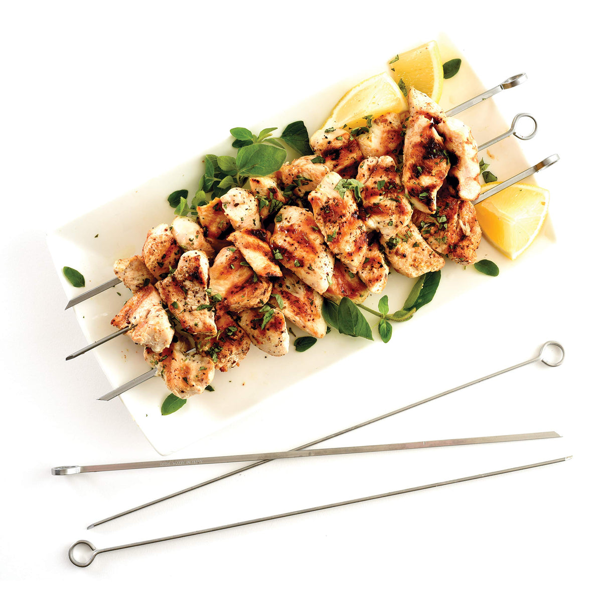 Norpro skewers on grill with beef and vegetables