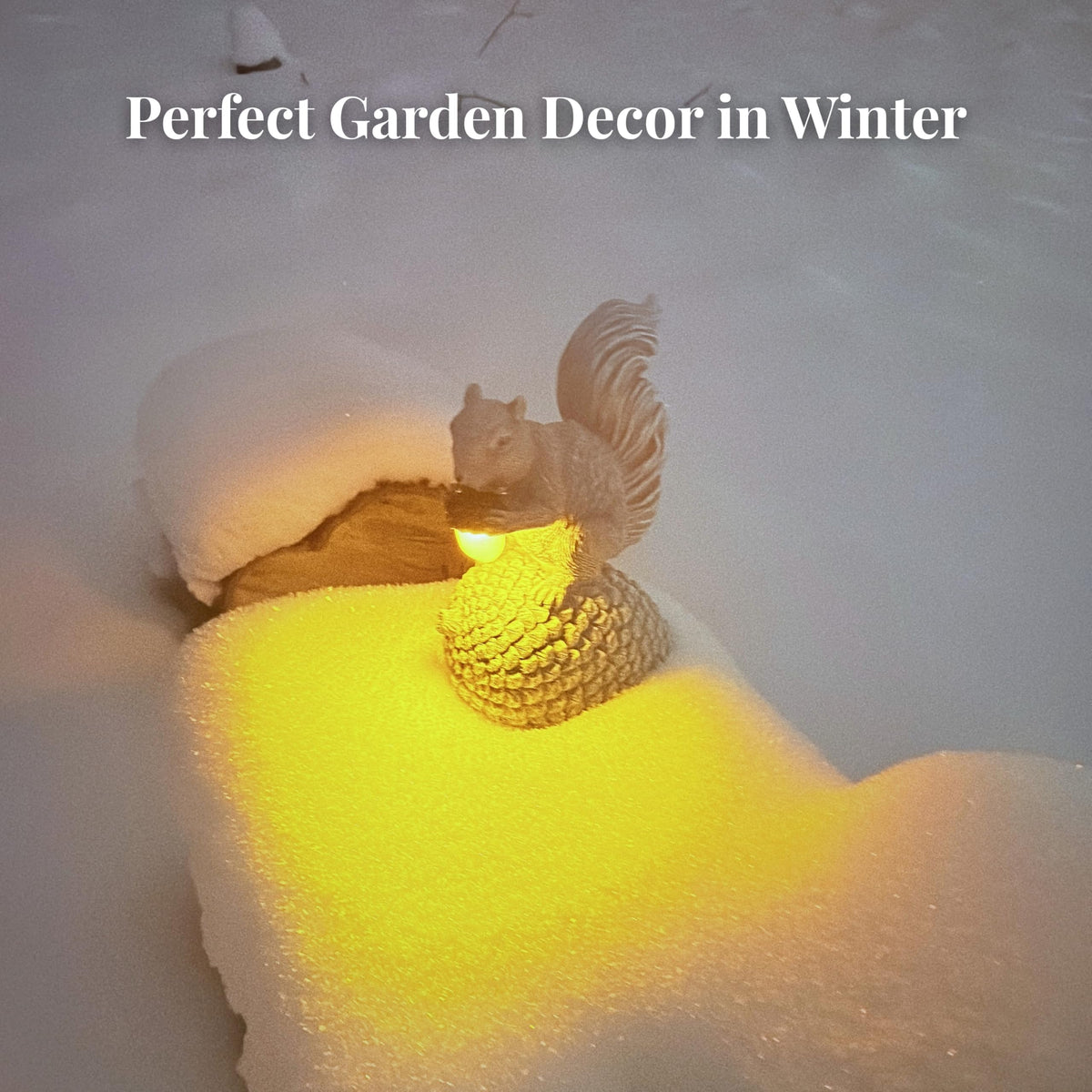 Norvylume hand-painted resin squirrel on pinecone glows softly at dusk