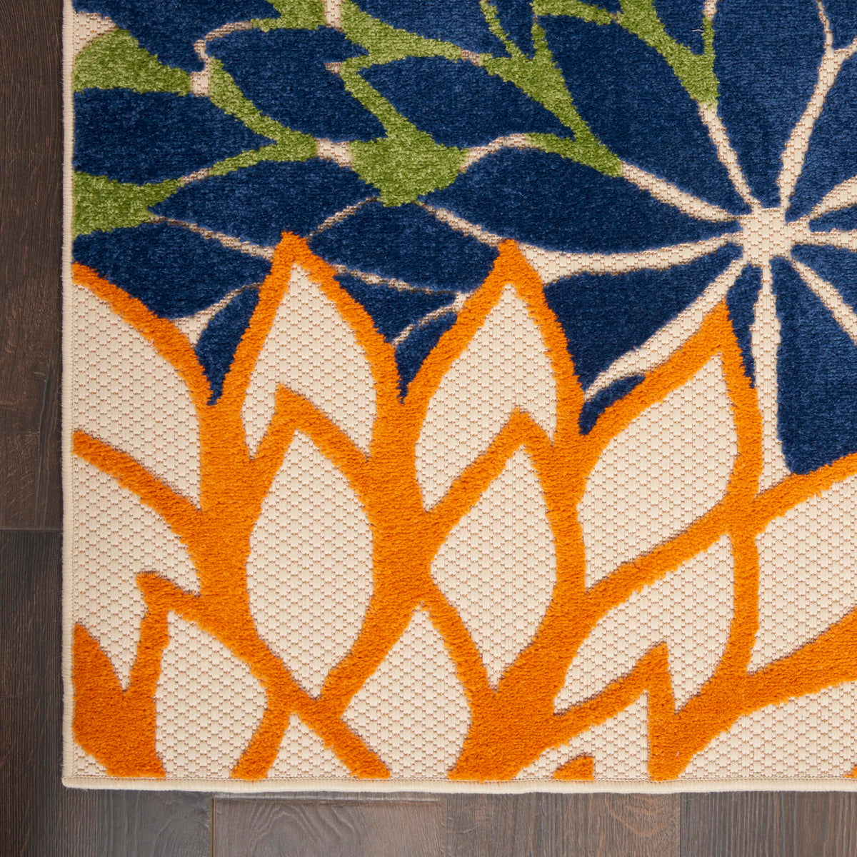 Nourison Aloha backyard corner ties decor together with tropical flair.