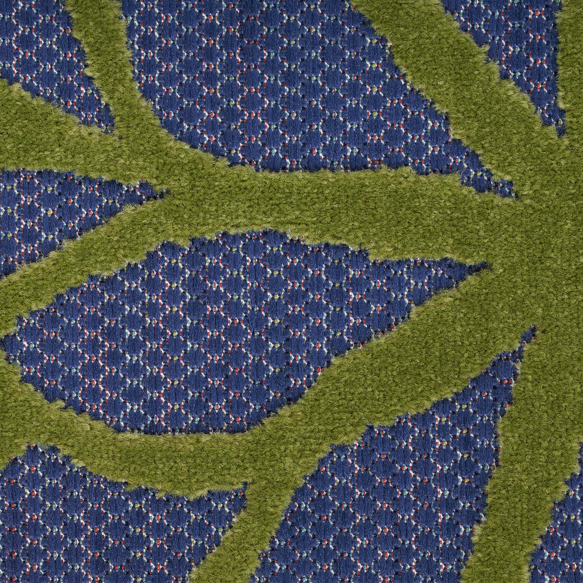 Nourison Aloha rug demonstrates easy cleaning by rinsing with a hose.