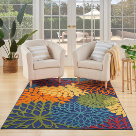 Nourison Aloha navy multicolor floral outdoor rug enhances patio styling and easy maintenance.