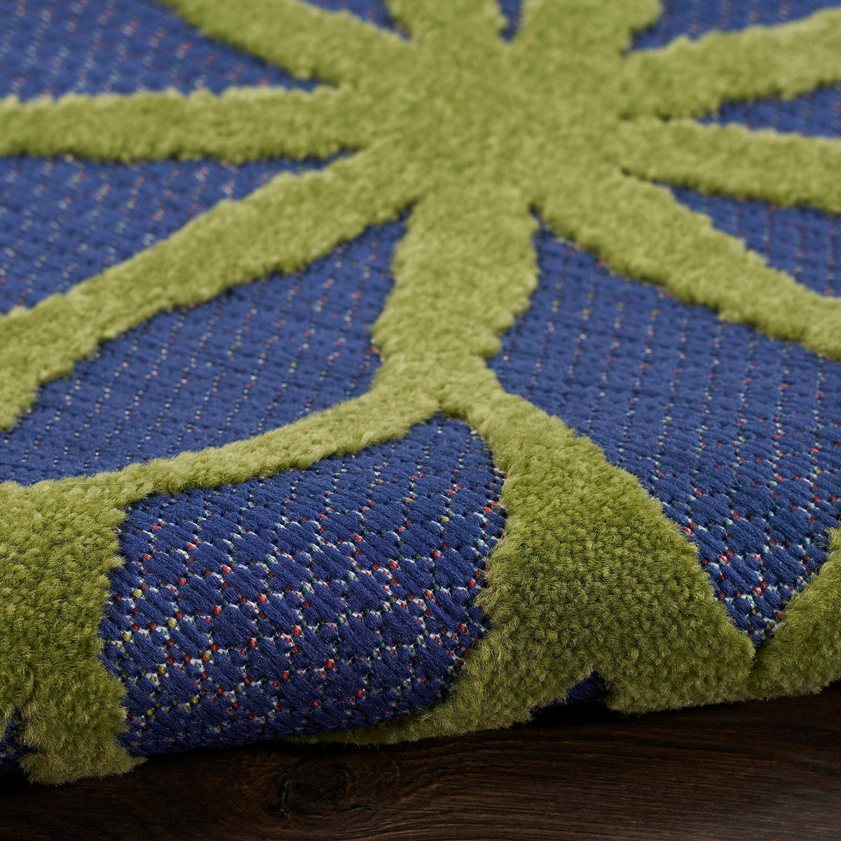Nourison Aloha vibrant color palette with orange, green, red, blue, and yellow hues.