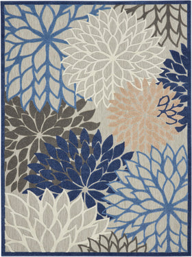 Nourison Aloha oversized floral pattern in blue beige creates tropical flair.
