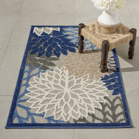 Nourison Aloha rug with oversized blue floral pattern for patios and decks.