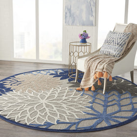 Nourison Aloha round rug with high low pile enhances tactile feel.