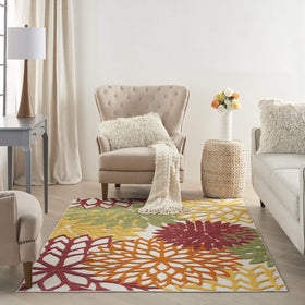 Nourison Aloha rug with bright tropical colors creates a vibrant deck focal point.
