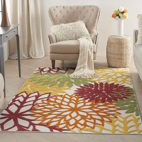 Nourison Aloha floral-pattern rug adds tropical charm to outdoor spaces with easy-clean care.