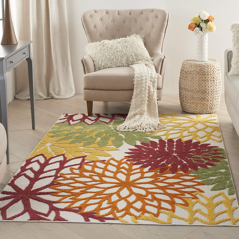 Nourison Aloha floral-pattern rug adds tropical charm to outdoor spaces with easy-clean care.