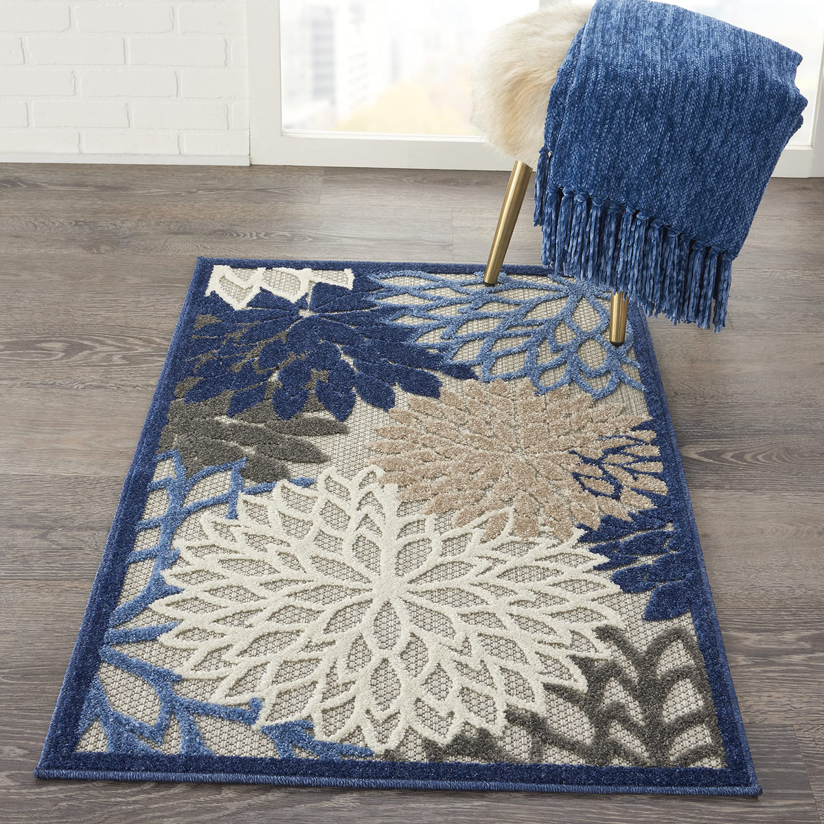 Nourison Aloha fibers are stain-resistant polypropylene for easy cleaning outdoors.