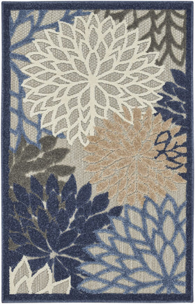 Nourison Aloha surface features a textured high-low pile for tactile outdoor appeal.