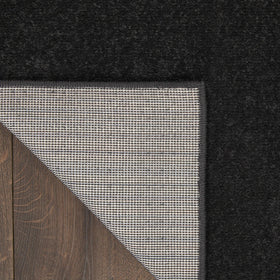 Nourison Essentials Black 5' x Square rug edge detail, serged for clean lines.
