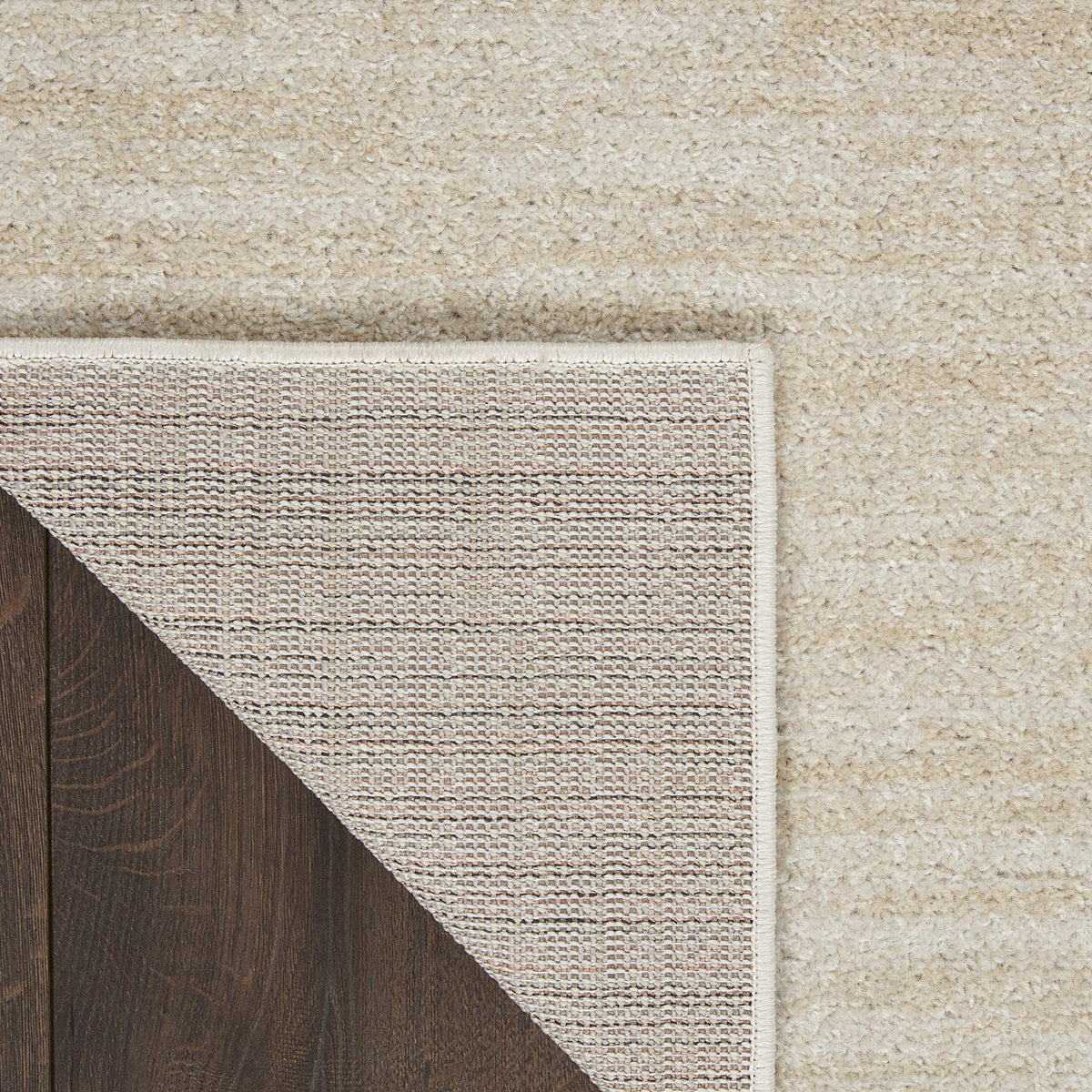 Nourison Essentials Ivory Beige bedroom layout offers soft underfoot comfort.