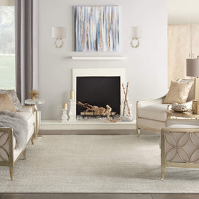 Nourison Essentials Ivory Beige rug in dining area shows low pile ideal beneath chairs.