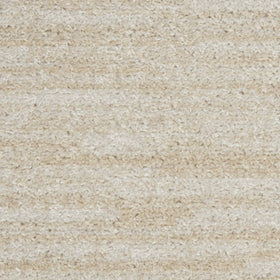 Nourison Essentials Ivory Beige edge-serged detail highlights durability and clean finish.