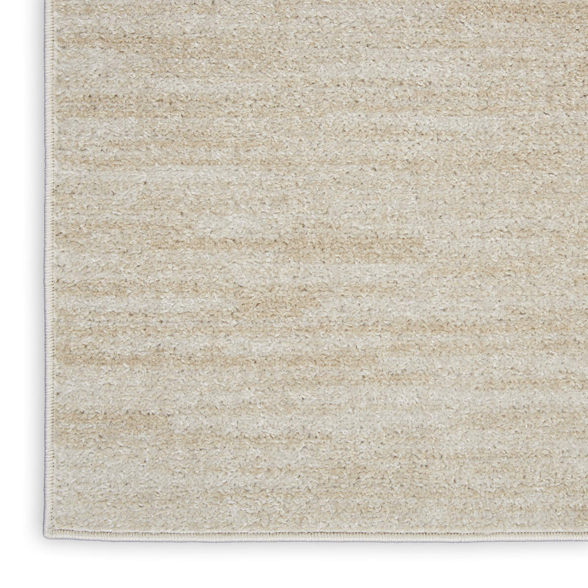 Nourison Essentials Ivory Beige rug layers well with patterned pieces for a balanced look.