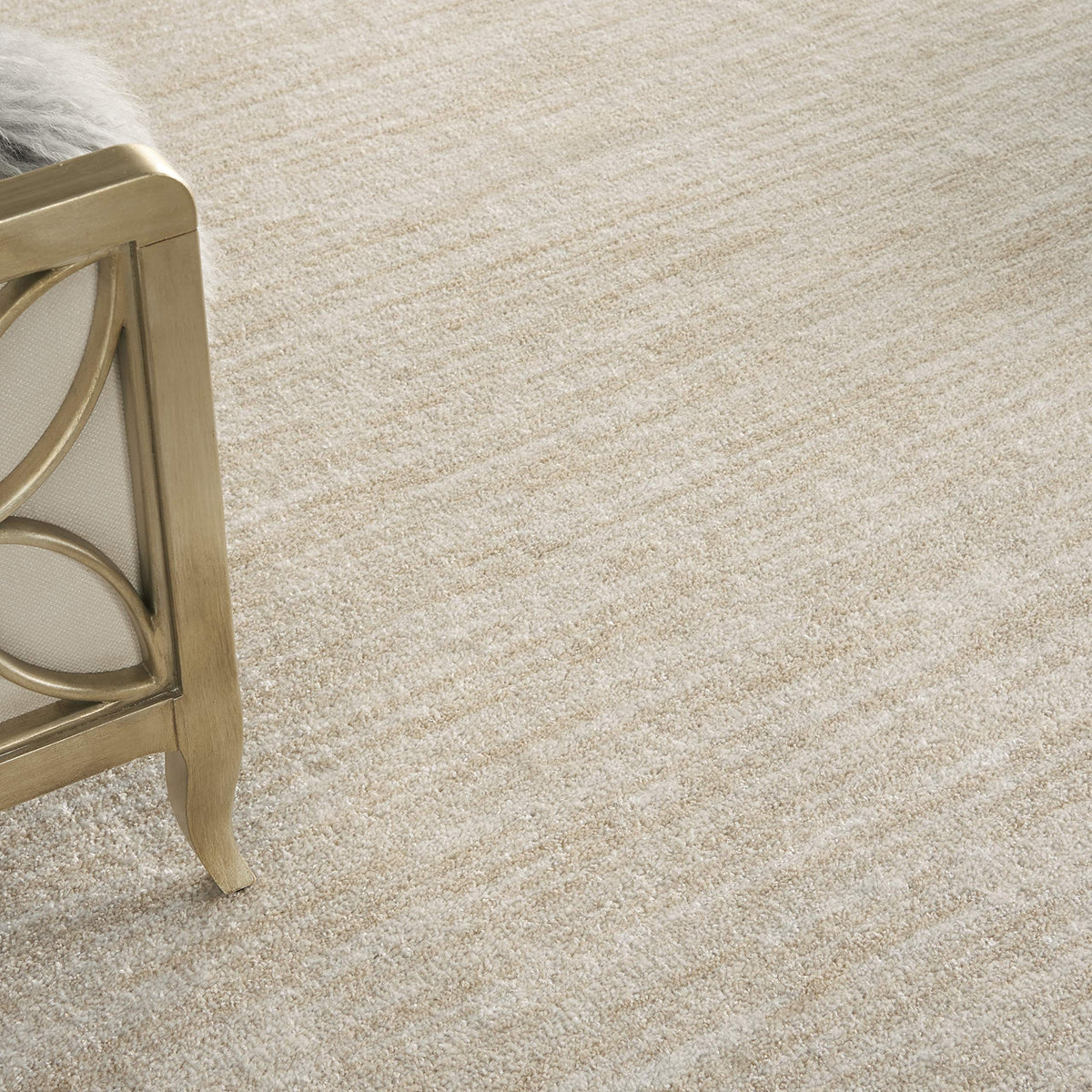Nourison Essentials Ivory Beige rug in living room setup adds versatile, easy-care style.