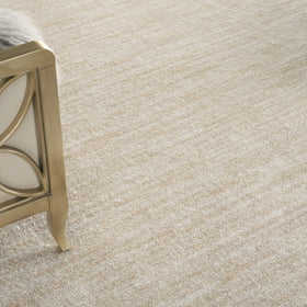 Nourison Essentials Ivory Beige rug in living room setup adds versatile, easy-care style.