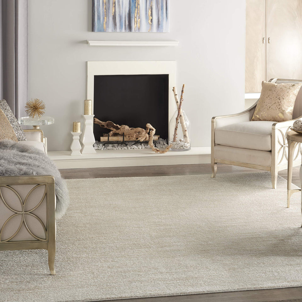 Nourison Essentials Ivory Beige 7x10 rug closeup weave highlights soft texture underfoot.