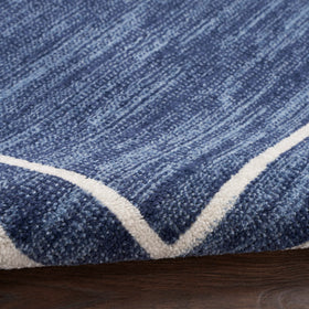 Nourison Essentials Navy/Ivory pet-friendly rug resists shedding and cleans up easily after pets.