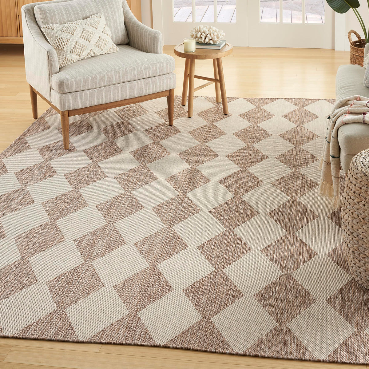 Nourison Positano beige 57x7 area rug with diamond pattern enhances indoor and outdoor spaces