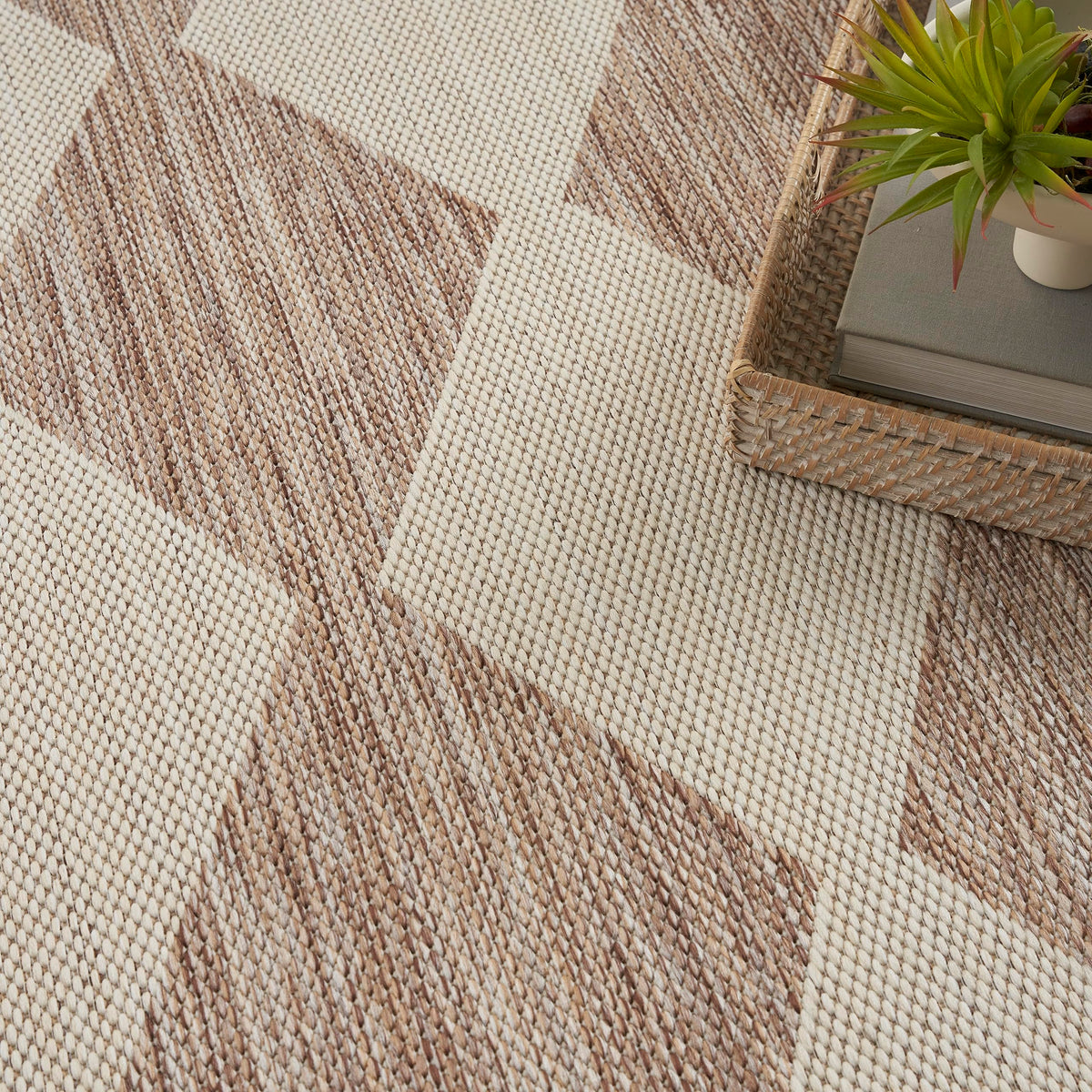 Nourison Positano beige rug complements dining room aesthetics with subtle pattern