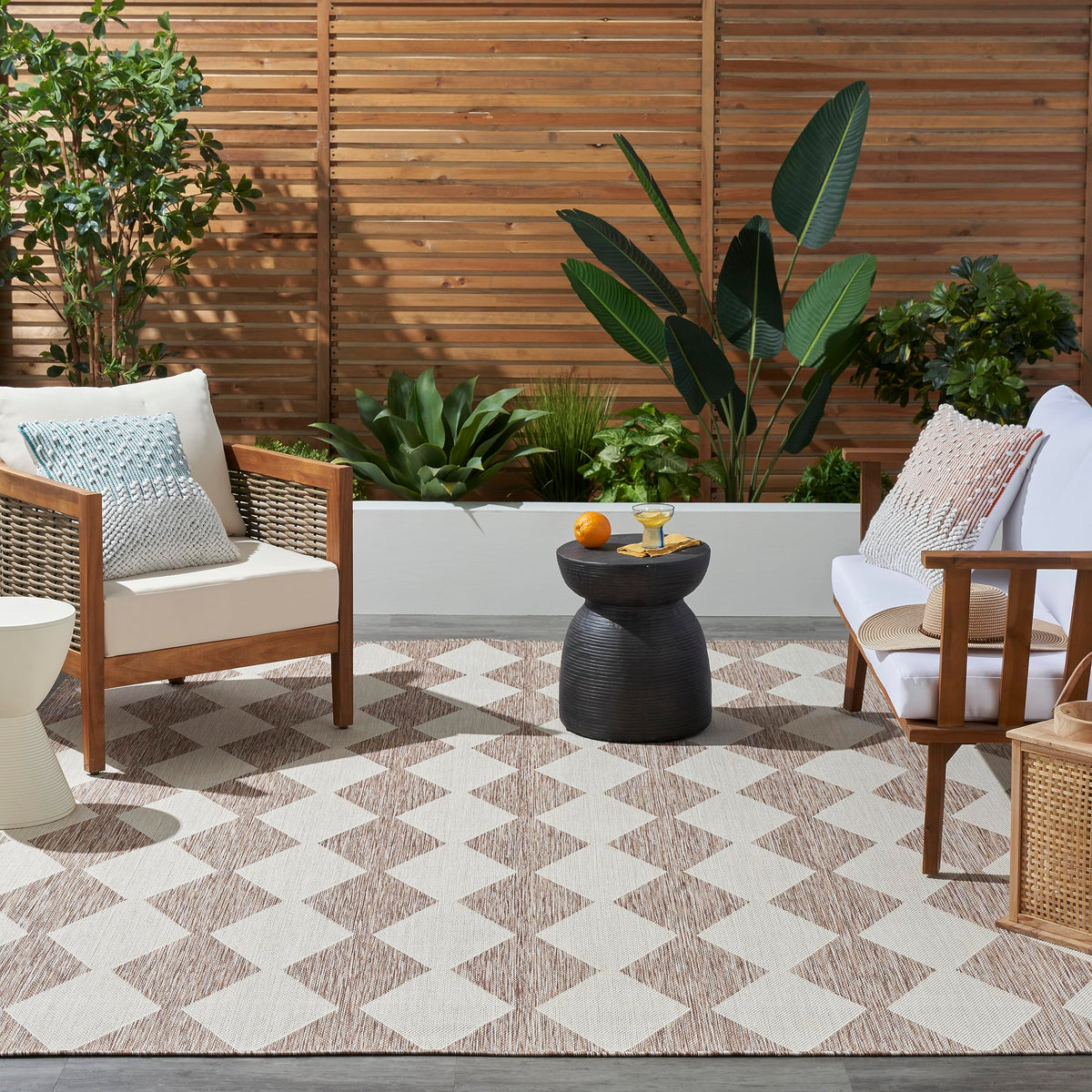Nourison Positano beige rug in outdoor patio setting for weather-friendly entertaining