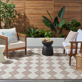 Nourison Positano beige rug in outdoor patio setting for weather-friendly entertaining