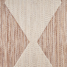 Nourison Positano beige rug on a porch elevating outdoor-to-indoor transition