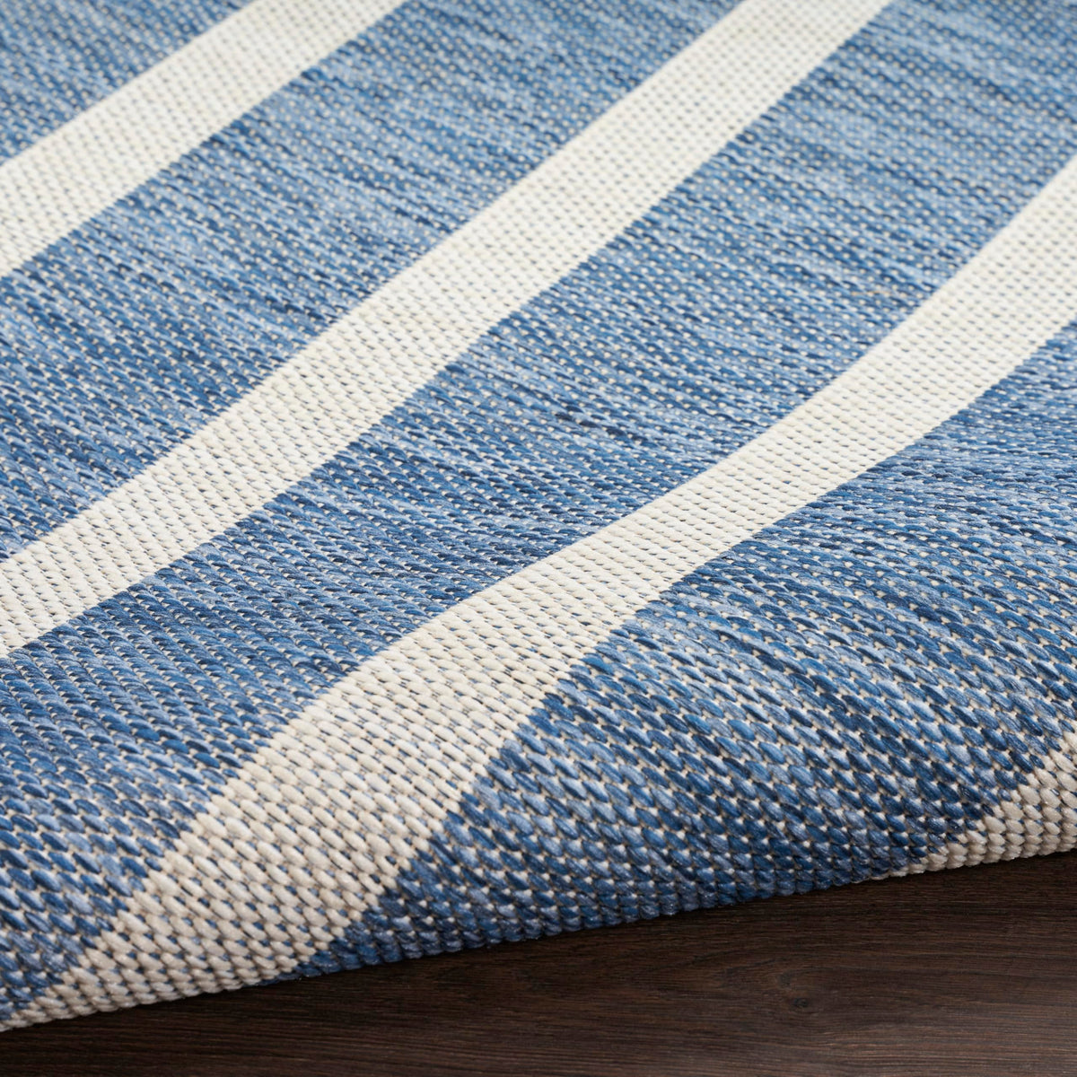 Nourison Positano navy ivory tones enhance coastal-inspired decor.