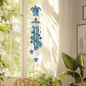 Nowpis wind chime hanging on patio in a sunny outdoor space