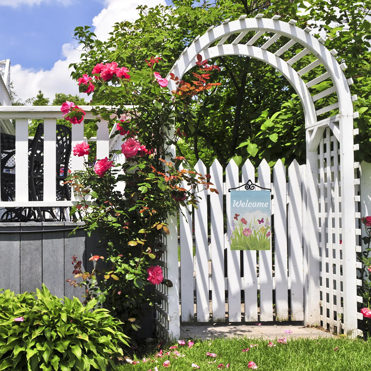 NQ garden flag wall hanger outdoors on a garden wall showing durable design.