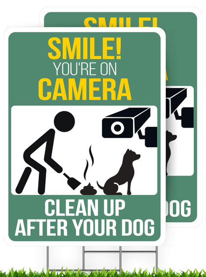 Nuah Prints clean up after your dog sign in the front yard with a stake for high visibility.