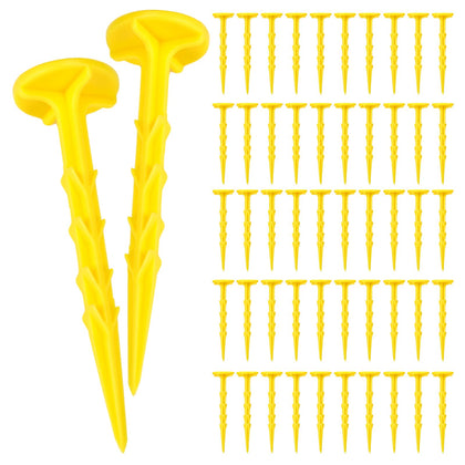 Nuanchu low-profile yellow survey stake in soil for discreet marking