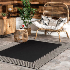 nuLOOM Asha rug with striped border defines indoor/outdoor seating areas.