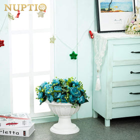 NUPTIO white urn planters pair well with artificial or real plants.