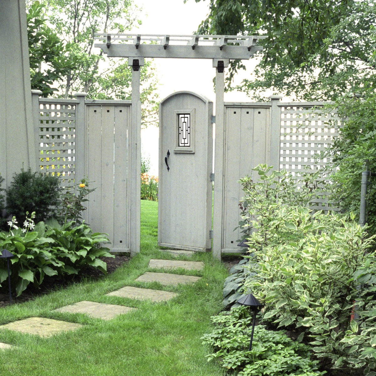 Nuvo Iron decorative insert on a privacy wall adds weather resistance and style