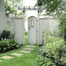 Nuvo Iron decorative insert on a privacy wall adds weather resistance and style