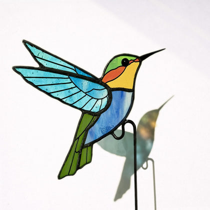 Nuvos AEON hummingbird stained glass plant stake adds colorful light to indoor planters
