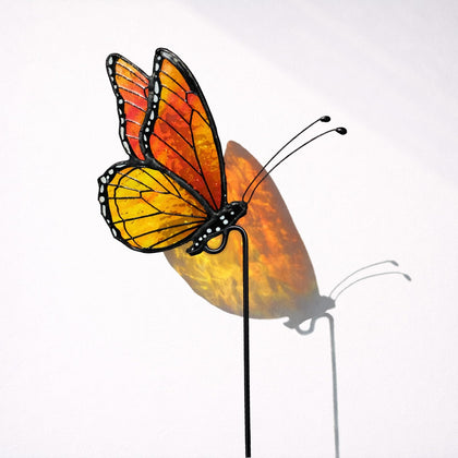 Nuvos AEON Monarch butterfly stained glass suncatcher with vibrant color.