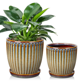 Oairse brown ceramic pot with 4.9-inch opening and drainage for healthy roots.